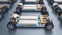 Rows of electric vehicles with battery packs.