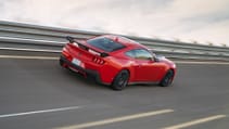 Mustang Dark Horse driving along a track