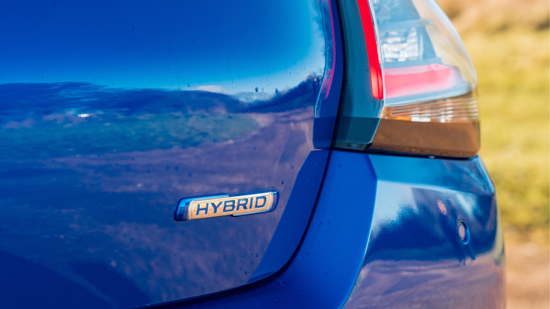 Close up of the back right taillight of blue Suzuki Swift
