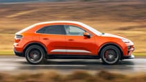 Porsche Macan driving on a road
