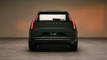 Volvo EX60 set against a studio background, pictured from the back