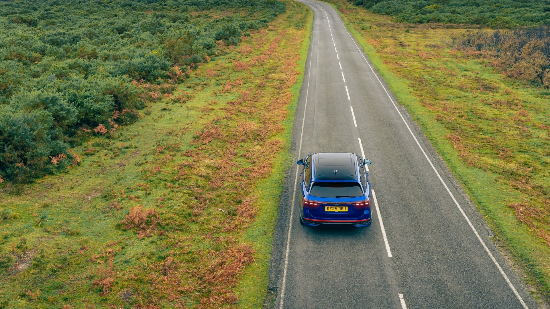 Volkswagen Passat Estate driving on a rural road