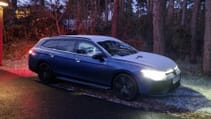 Volkswagen Passat Estate parked outside on a snow evening