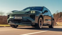 Porsche Cayenne Turbo Electric, driving on a road, pictured from the front