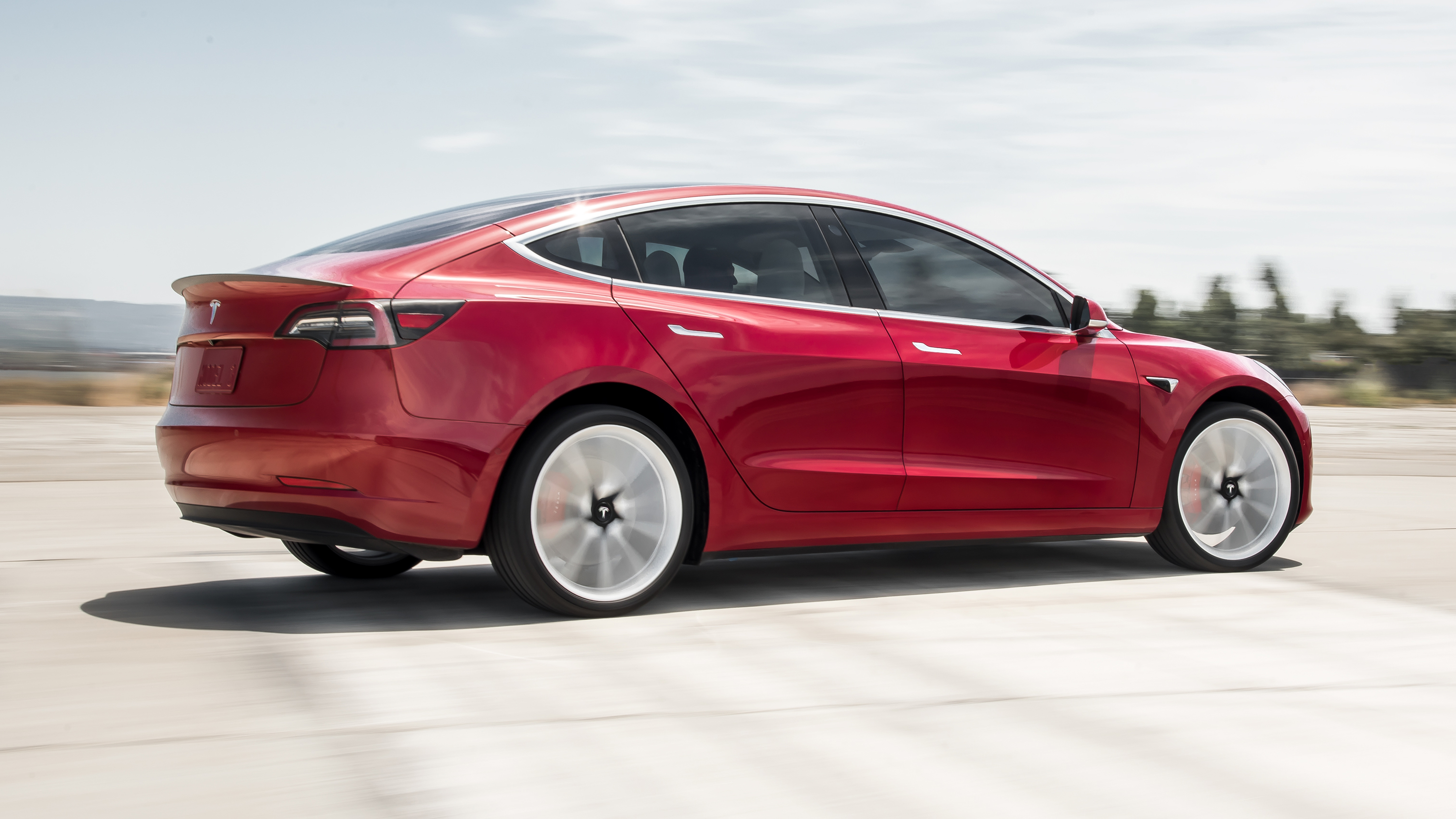 model_3_performance_-_red_rear_motion.jpg