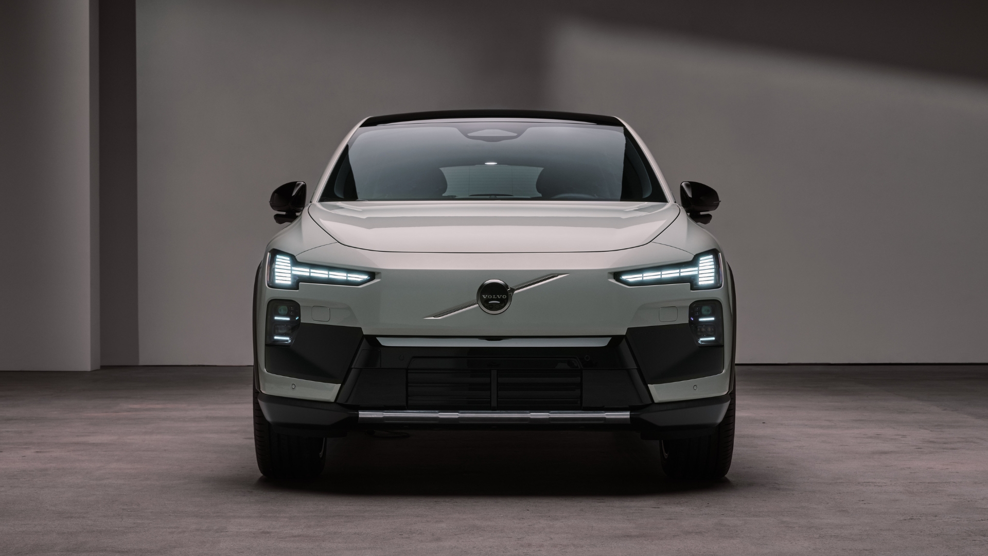 Volvo EX60 Cross Country set against a studio backdrop, pictured from the front