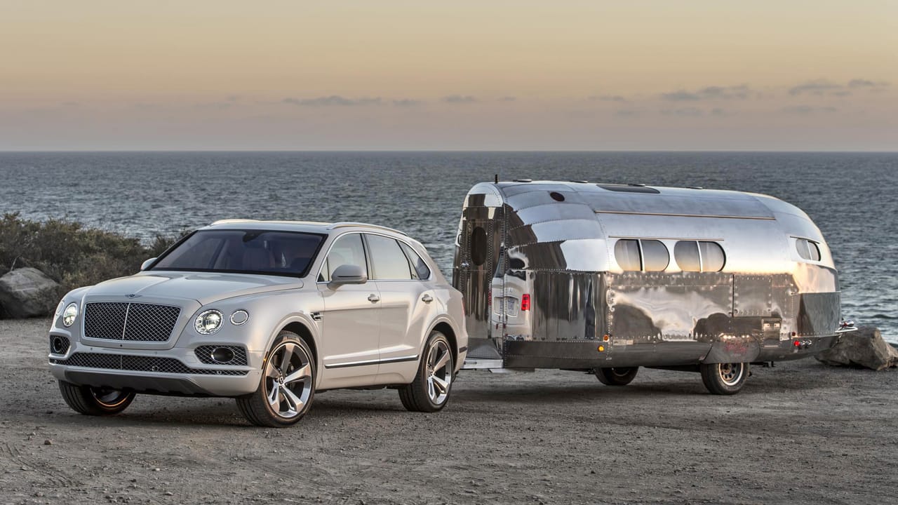 This is a Bentley towing a shiny caravan Top Gear