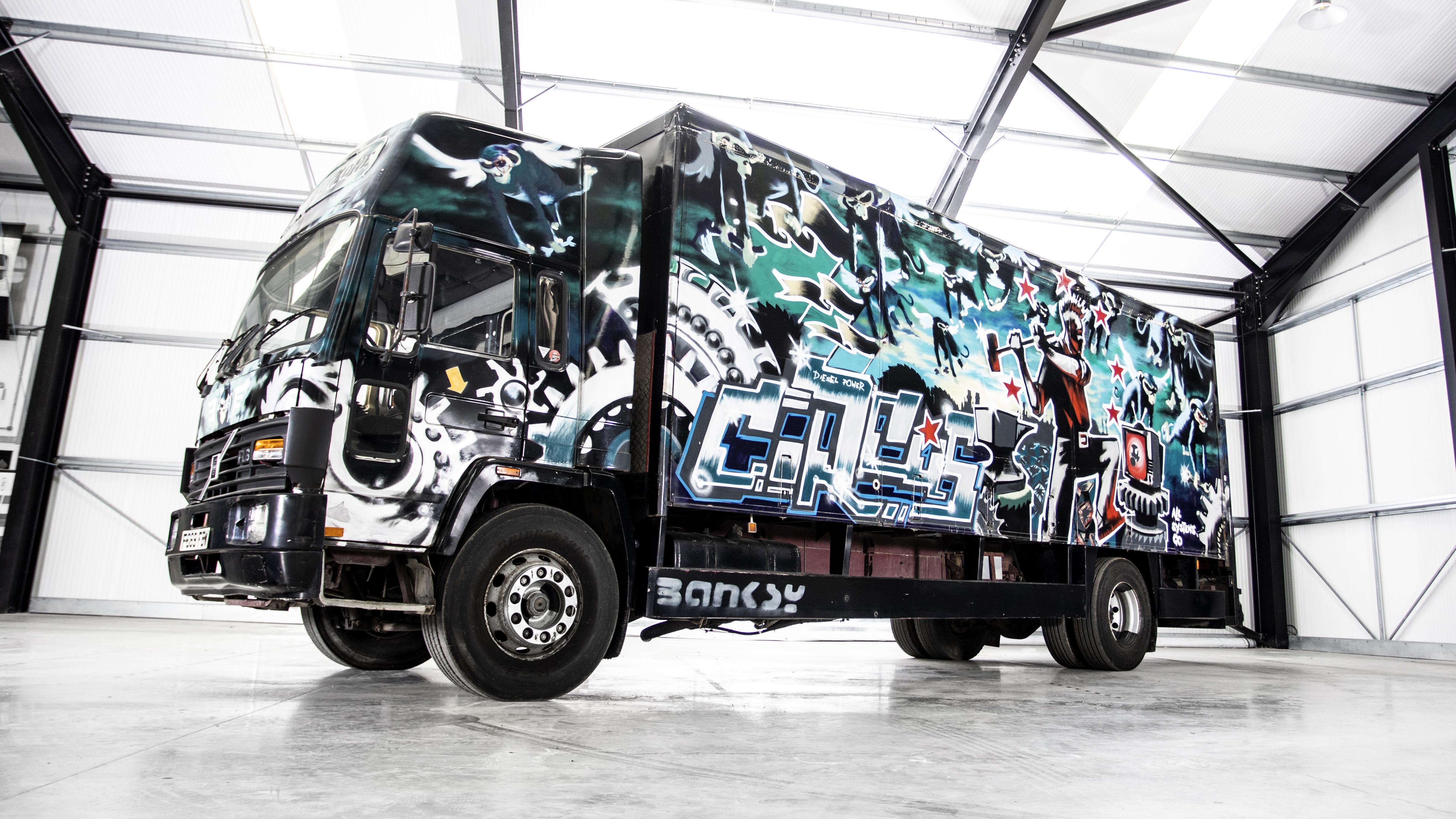 This Volvo painted by Banksy is expected to sell for over