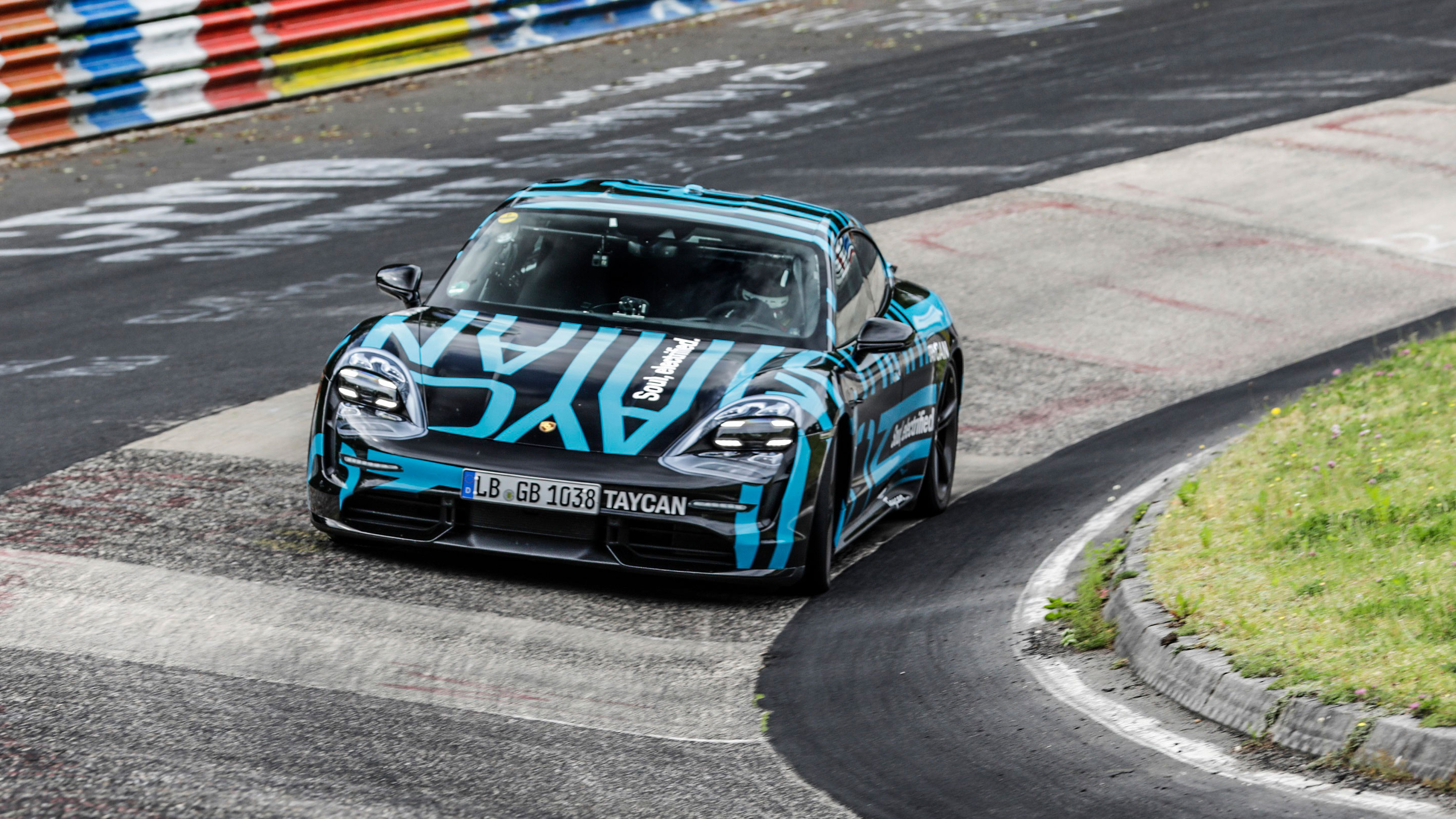 high_taycan_prototype_in_the_karussell_section_nurburgring_nordschleife_2019_porsche_ag.jpg
