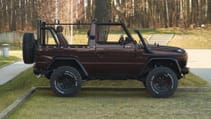 expedition-motor-company-rubellite-red-full-passenger-side-view-day-time.jpg