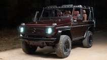 expedition-motor-company-rubellite-red-wolf-front-side-angle-driver-side-night-time.jpg