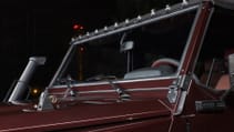 expedition-motor-company-rubellite-red-wolf-front-windshield-close-up-night-time.jpg