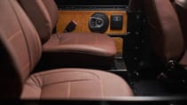 expedition-motor-company-rubellite-red-wolf-interior-back-seats-close-up.jpg