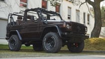 expedition-motor-company-rubellite-red-wolf-low-angle-passenger-side-day-time-view.jpg