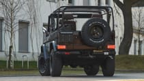 expedition-motor-company-rubellite-red-wolf-low-angle-rear-view-day-time.jpg