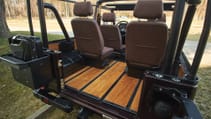 expedition-motor-company-rubellite-red-wolf-open-trunk-rear-view-day-light.jpg