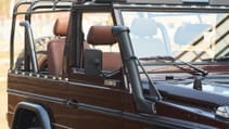 expedition-motor-company-rubellite-red-wolf-passenger-side-angled-view-day-time.jpg