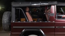 expedition-motor-company-rubellite-red-wolf-passenger-side-open-window-night-time.jpg