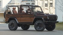 expedition-motor-company-rubellite-red-wolf-passenger-side-view-day-time.jpg