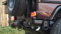 expedition-motor-company-rubellite-red-wolf-rear-bumper-close-up-day-time.jpg