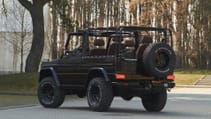 expedition-motor-company-rubellite-red-wolf-rear-driver-side-angled-view-day-time.jpg
