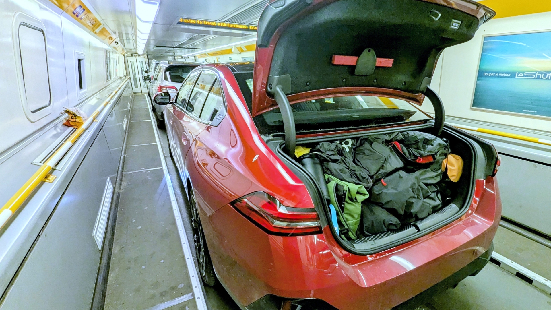 BMW 550e opened boot with luggage inside