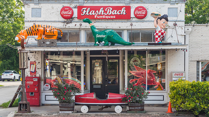 The exterior of a retail store, FlashBack Funtiques, featuring an array of ornamental antiques