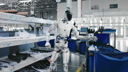 Xpeng Iron humanoid robot distributing parts into bins in a production facility