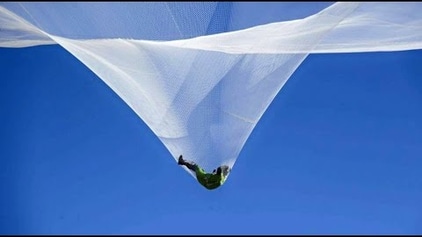 Watch a man jump into a net from 25,000ft without a parachute | Top Gear