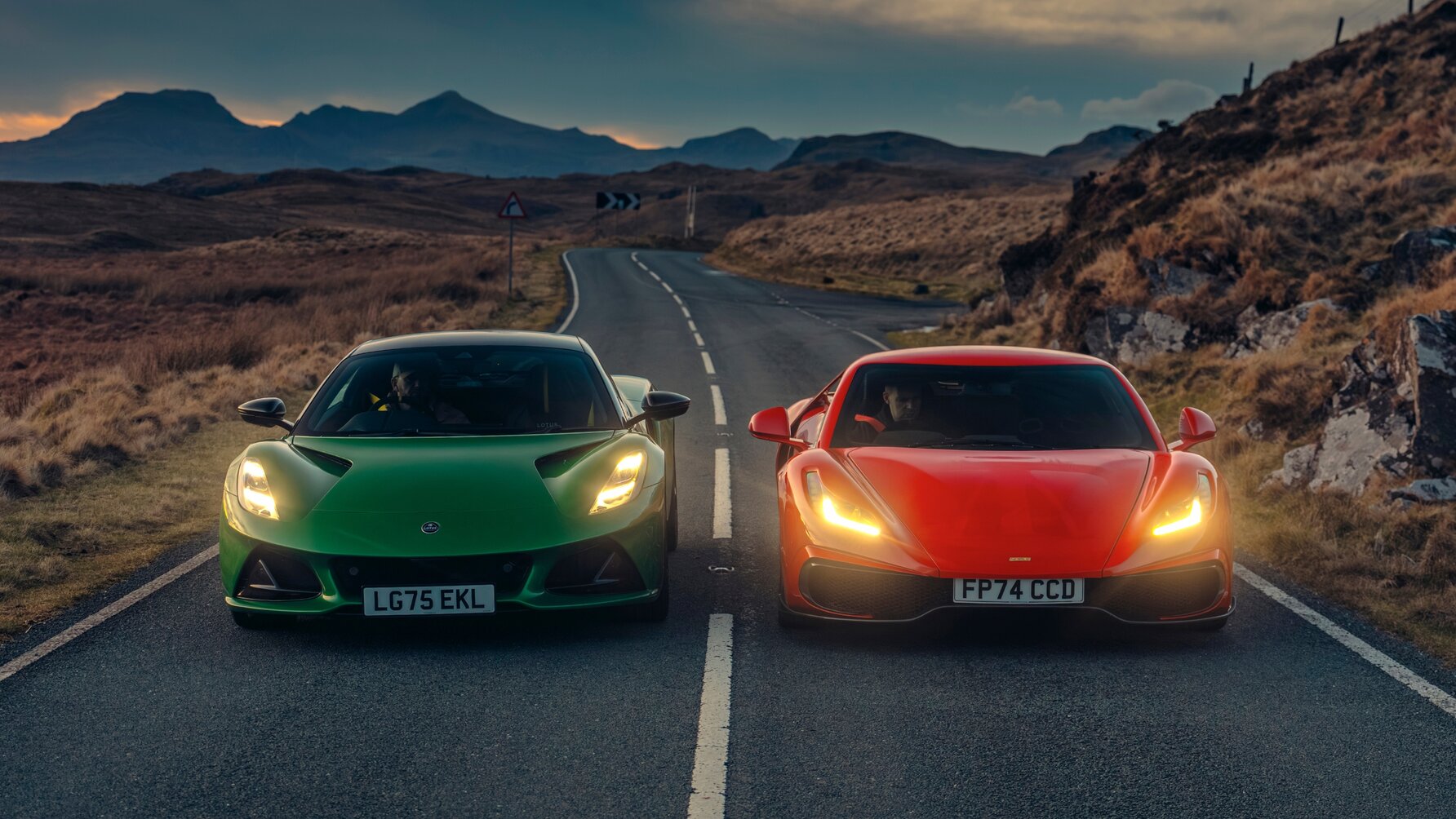 Noble M500 and Lotus Emira driving next to each other, pictured from the front