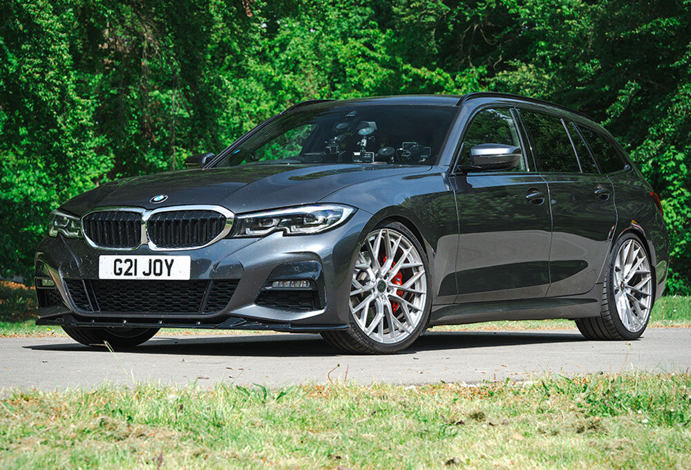 A black 2022 BMW 330D Touring